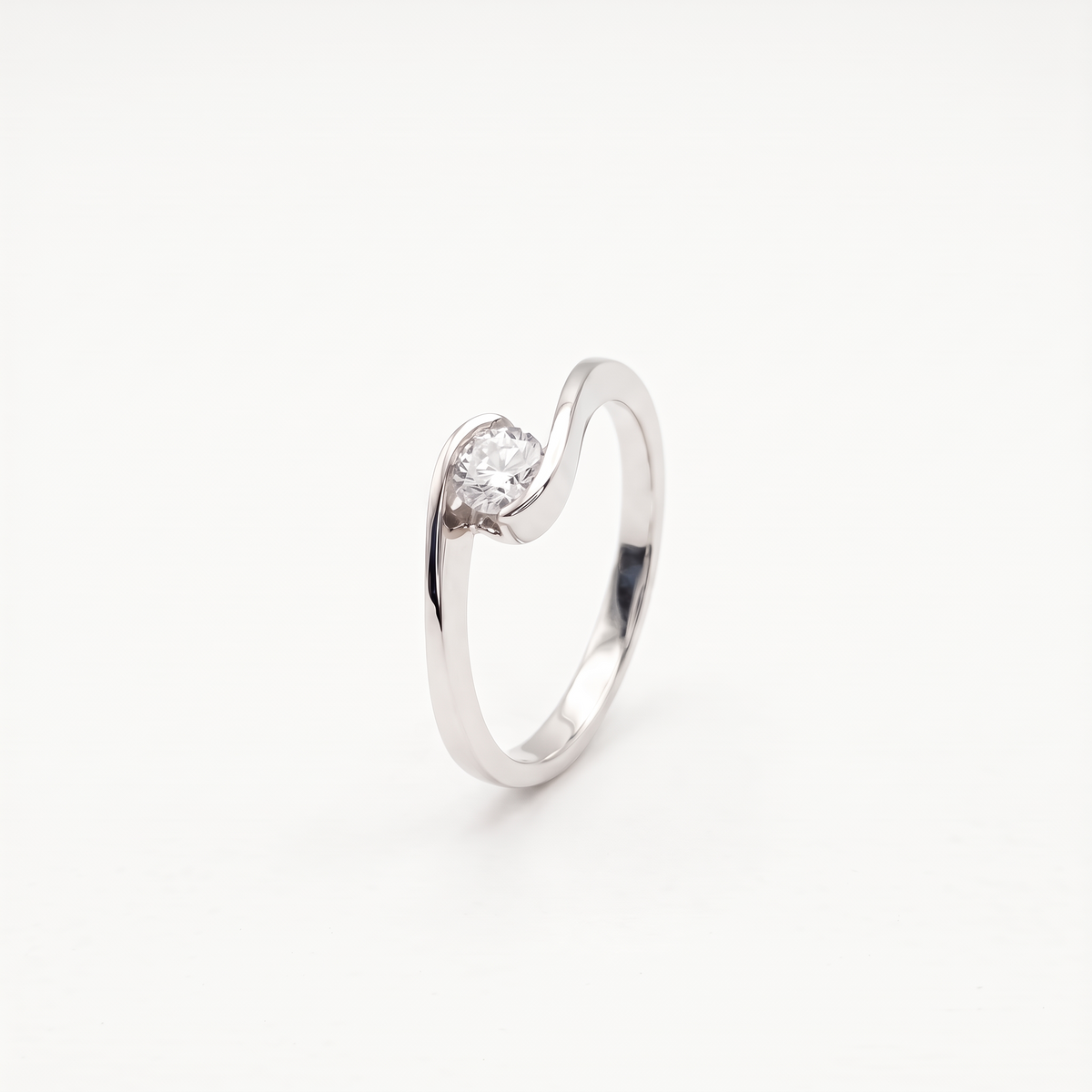 Moissanite bypass solitaire ring, front view on white