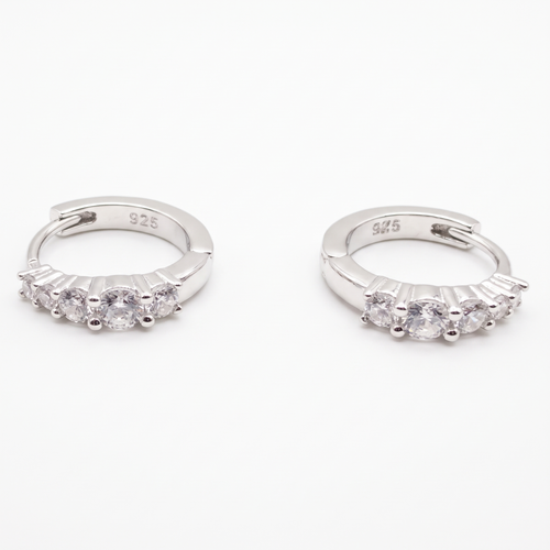 AnastasiaRio five-stone moissanite huggie hoops in 925 sterling silver, on white
