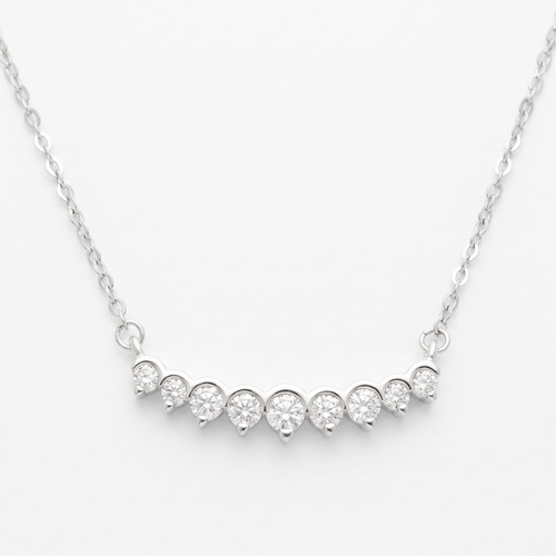 AnastasiaRio nine-stone moissanite curved bar necklace in 925 sterling silver, on white